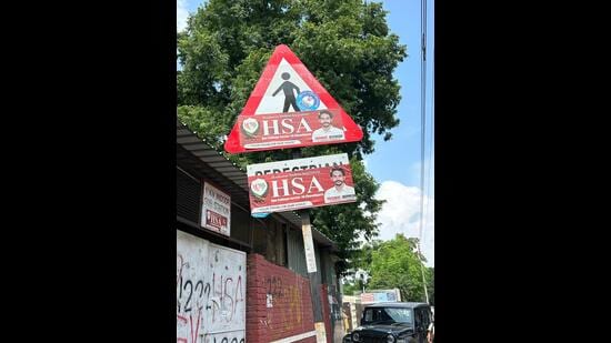 Signboards related to traffic and commuter safety have been defaced in Sectors 10, 11, 26, 32 and other areas. (HT Photo)