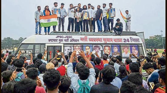 Student leader Devendra Nath Mahto, along with other members, stands on a bus during Recruitment Reform Yatra, alleging irregularities and a lack of transparency in the recruitment process in the JPSC-JSSC recruitment, in Hazaribagh on Wednesday. (ANI PHOTO)