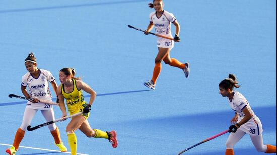 The Indian women’s hockey team in action against Australia in the FIH World Cup in Amstelveen on Sunday. (AFP)