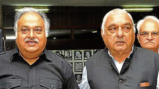 Former assembly speaker (L)Kuldeep Sharma with ex-CM (R) Bhupinder Singh Hooda in the assembly complex in Chandigarh. (Keshav Singh/Hindustan Times)