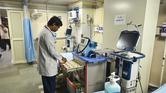 A doctor checks medical equipment in a dedicated isolation ward set up at Lok Nayak Jai Prakash (LNJP) Hospital for the treatment and management of H1N1 (swine flu) patients, in New Delhi on Tuesday. (ANI)