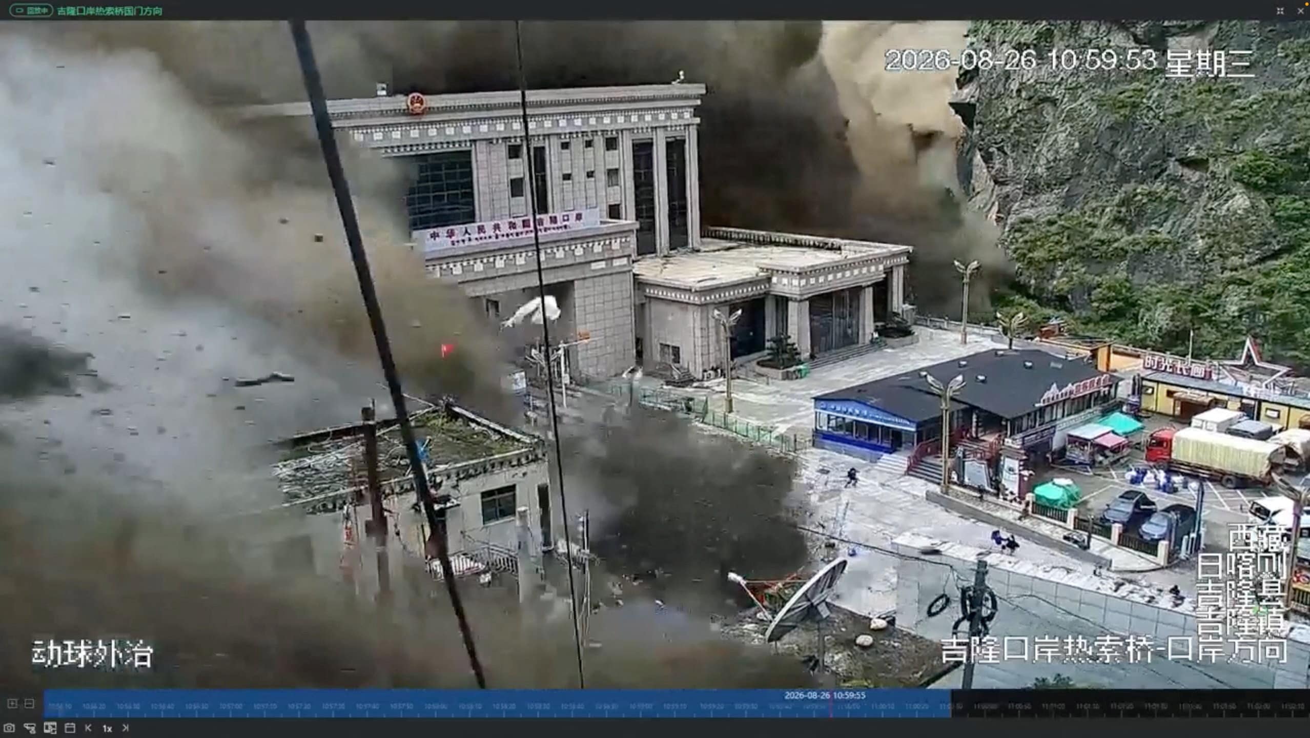 A CCTV footage shows people running away as wall of mud and water destroys buildings in a valley at Nepal-China border, in Gyirong, Tibet region, China August 26, 2026, in this screengrab obtained from a social media video. (via Reuters)