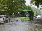 Commuters make their way through the waterlogged Baba Kharak Singh road after heavy rainfall, in New Delhi, Tuesday, Aug. 25, 2026. (PTI)