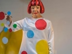  A life-like robot of artist Yayoi Kusama painting a window stands at the Louis Vuitton store on Fifth Avenue in New York City on January 13, 2023. (Photo by ANGELA WEISS / AFP) (AFP)