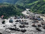 Floods washed away roads, bridges, houses, and power projects. (Reuters photo) Floods washed away roads, bridges, houses, and power projects. (Reuters photo)