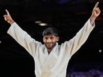 India's Harsh Singh celebrates after winning the men's 60kg judo gold at the Commonwealth Games in Glasgow. (AP)