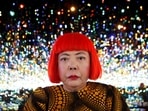 FILE PHOTO: Japanese artist Yayoi Kusama poses for a photograph inside her Infinity Mirrored Room installation titled "The Souls of Millions of Light Years Away" during a media preview of her new exhibition at the David Zwirner gallery in New York, U.S., November 7, 2013.  REUTERS/Mike Segar/File Photo     TPX IMAGES OF THE DAY