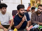 Cockroach Janta Party (CJP) founder Abhijeet Dipke addresses a press conference as party spokepersons Saurav Das and Ashutosh Ranka look on, amid the ongoing protest over NEET paper leak issue, at Jantar Mantar.