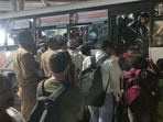 Passengers, including women, boarding an already crowded UPSRTC bus at Awadh bus station (HT Photo)