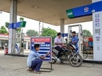 A worker updates prices at a petrol pump in Nadia, West Bengal.(PTI File Photo)