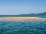The island is essentially a low-lying sandbar whose visibility is governed by the tides.(AI-generated image)