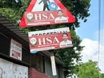 Signboards related to traffic and commuter safety have been defaced in Sectors 10, 11, 26, 32 and other areas. (HT Photo)