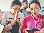 Family members check a list of people who were injured after the flash floods, at Bir Hospital in Kathmandu, Nepal on Wednesday.