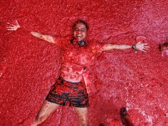 Every year, the small town of Bunol, near Valencia in Spain, turns red as revellers arrive to celebrate the world's biggest tomato fight, La Tomatina.&nbsp;
