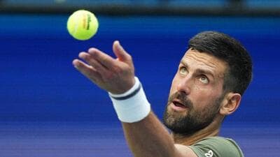 Novak Djokovic of Serbia serves to Alexander Zverev during a practice session at the US Open. (AP) Novak Djokovic of Serbia serves to Alexander Zverev during a practice session at the US Open. (AP)