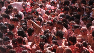 The festival is held every year on the last Wednesday of August. This year, it was celebrated on August 26, 2026. Revellers gathered to throw tomatoes at each other during the annual tomato fight fiesta. (AP Photo/Alberto Saiz) The festival is held every year on the last Wednesday of August. This year, it was celebrated on August 26, 2026. Revellers gathered to throw tomatoes at each other during the annual tomato fight fiesta. (AP Photo/Alberto Saiz)