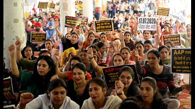 The employees staging a protest at Sector 17, Chandigarh, on Thursday. (Ravi Kumar/ HT)