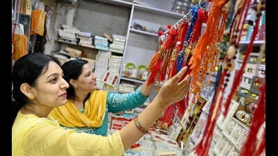 Women buying Rakhi ahead of Raksha Bandhan eve in Chandigarh on Thursday. (Ravi Kumar/HT)