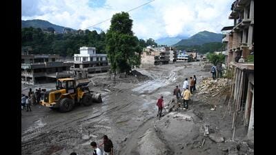Workers use excavators to clear the mud following flash floods in Trishuli in Nepal’s Nuwakot district on Thursday. (AFP) Workers use excavators to clear the mud following flash floods in Trishuli in Nepal’s Nuwakot district on Thursday. (AFP)