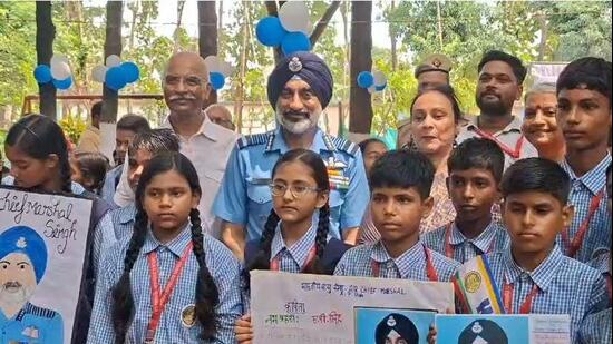 Air chief marshal AP Singh with students at Mathabari village in Gorakhpur on Thursday. (SOURCED)