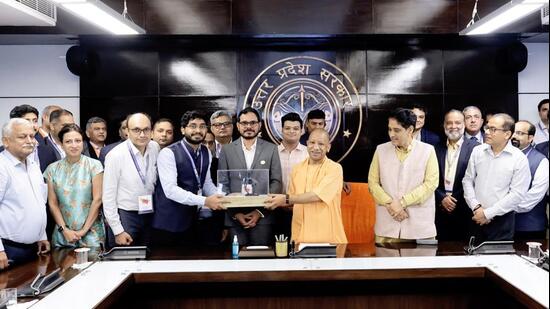 Chief minister Yogi Adityanath with several startup heads at the event in Lucknow. (HT)