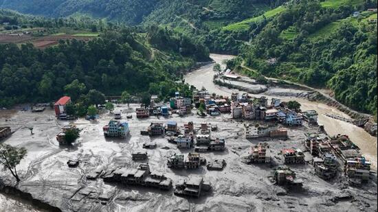 Floods washed away roads, bridges, houses, and power projects. (Reuters photo)