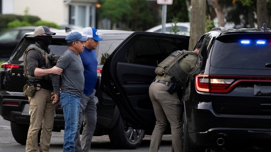 ICE agents detain two individuals outside a home in Danbury, Connecticut on August 27. (Representational)