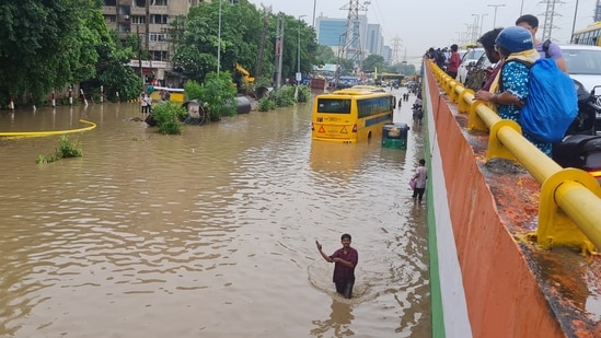 Gurugram, India-August 24, 2026: School buses remain stuck on a waterlogged road following heavy monsoon rain at Subhash Chowk near Sector 47 in Gurugram, India, on Monday, 24 August 2026.(Photo by Hindustan Times)