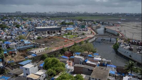 The land around Mumbai’s Chhatrapati Shivaji Maharaj International Airport is owned by the Airports Authority of India and leased to the Mumbai Metropolitan Region Development Authority and the airport operator. Over decades, slums encroached on the AAI land, occupying 275 acres. (Satish Bate/Hindustan Times)