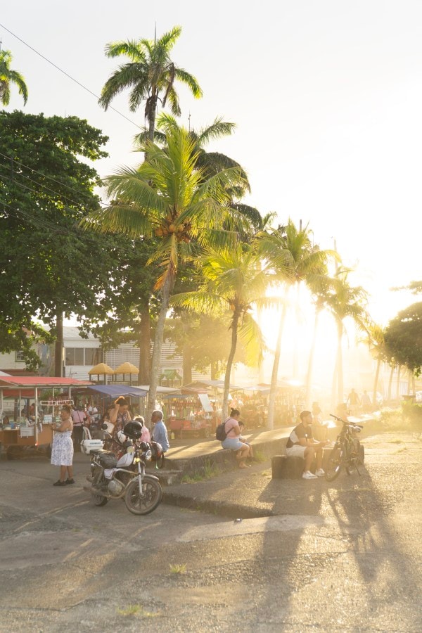 The Malecón waterfront in Limón. Residents watch a police operation from a downtown street.