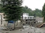 Nepal floods LIVE: A man clicks a picture of devastation in a residential area following a mud-laden flash flood caused by an outburst in the Bhotekoshi River, in Rasuwa.