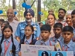 Air chief marshal AP Singh with students at Mathabari village in Gorakhpur on Thursday. (SOURCED)