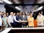Chief minister Yogi Adityanath with several startup heads at the event in Lucknow. (HT)