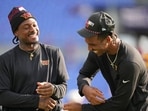 Washington Commanders wide receiver Stefon Diggs, and quarterback Jayden Daniels share a laugh before an NFL preseason football game in Baltimore.