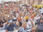 Government employees raise slogans during a statewide strike outside deputy commissioner's office in Amritsar on Thursday. (Sameer Sehgal/HT)