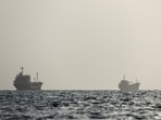 Vessels in the Strait of Hormuz are visible near the beach of Bandar Abbas, Iran, August 27, 2026.