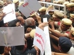 Leader of the Opposition Bhupinder Singh Hooda, along with other Congress MLAs, being stopped at the assembly entrance, in Chandigarh on Thursday. (Keshav Singh/HT)