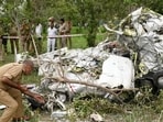 Police personnel at the site of the plane crash in Kanpur. (ANI PHOTO)