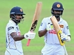 Sri Lanka's Kamindu Mendis (L) celebrates with Pasindu Sooriyabandara after scoring a half-century during the fourth day of the second Test match between Sri Lanka and India at the Sinhalese Sports Club Ground in Colombo. (AFP)