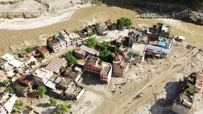 A drone view of the devastation in Devighat area following a mud-laden flash flood caused by an outburst in the Bhotekoshi River, in Nuwakot on Thursday. (ANI Video Grab) A drone view of the devastation in Devighat area following a mud-laden flash flood caused by an outburst in the Bhotekoshi River, in Nuwakot on Thursday. (ANI Video Grab)