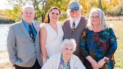Alan Smith (far left) is pictured with Megan Ghekiere, Dana Smith (Father), Barbara (Mother) Smith, and Evelyn Smith (grandmother). (X | @SeeRacists) Alan Smith (far left) is pictured with Megan Ghekiere, Dana Smith (Father), Barbara (Mother) Smith, and Evelyn Smith (grandmother). (X | @SeeRacists)