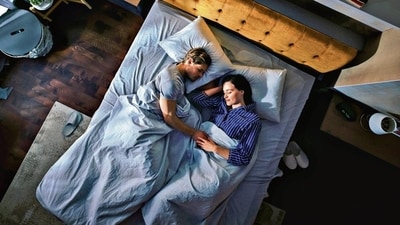 Popular in Nordic countries, the Scandinavian sleep method allows each person to choose their preferred level of comfort without disturbing their partner. (Adobe Stock)