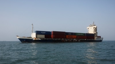 A vessel in the Strait of Hormuz visible near the beach of Bandar Abbas. (via REUTERS)