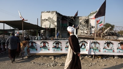 People visit Minab school, which was damaged in a strike on February 28, when US and Israel launched air attacks against Iran. (WANA via Reuters)
