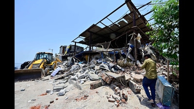 Mumbai, India - May 12, 2026: Heavy police security was deployed at the Mumbai Port Authority colony in Darukhana, Coal Bunder, as authorities began demolishing homes alleged to be illegal, some of which residents claim have existed since 1949, leading to evictions, in Mumbai, India, on Tuesday, May 12, 2026. (Photo by Anshuman Poyrekar/Hindustan Times) (Anshuman Poyrekar/HT Photo) Mumbai, India - May 12, 2026: Heavy police security was deployed at the Mumbai Port Authority colony in Darukhana, Coal Bunder, as authorities began demolishing homes alleged to be illegal, some of which residents claim have existed since 1949, leading to evictions, in Mumbai, India, on Tuesday, May 12, 2026. (Photo by Anshuman Poyrekar/Hindustan Times) (Anshuman Poyrekar/HT Photo)