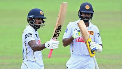 Sri Lanka's Kamindu Mendis (L) celebrates with Pasindu Sooriyabandara after scoring a half-century during the fourth day of the second Test match between Sri Lanka and India at the Sinhalese Sports Club Ground in Colombo. (AFP) Sri Lanka's Kamindu Mendis (L) celebrates with Pasindu Sooriyabandara after scoring a half-century during the fourth day of the second Test match between Sri Lanka and India at the Sinhalese Sports Club Ground in Colombo. (AFP)
