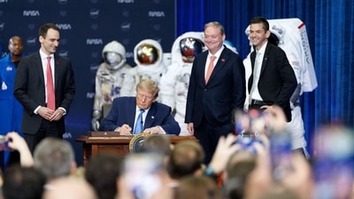 US President Donald Trump signs an executive order to create a US Space Academy at the NASA Johnson Space Center in Houston, Texas, US. (Bloomberg) US President Donald Trump signs an executive order to create a US Space Academy at the NASA Johnson Space Center in Houston, Texas, US. (Bloomberg)