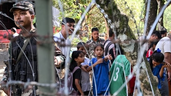 Children rescued from a flash flood at an army camp in Nepal's Nuwakot district.