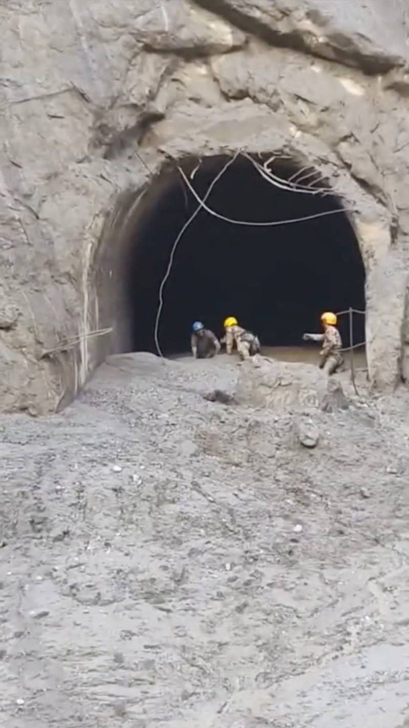 Rescuers evacuate a person from a tunnel of a hydropower project, in Rasuwa, Nepal. (Handout via Reuters)