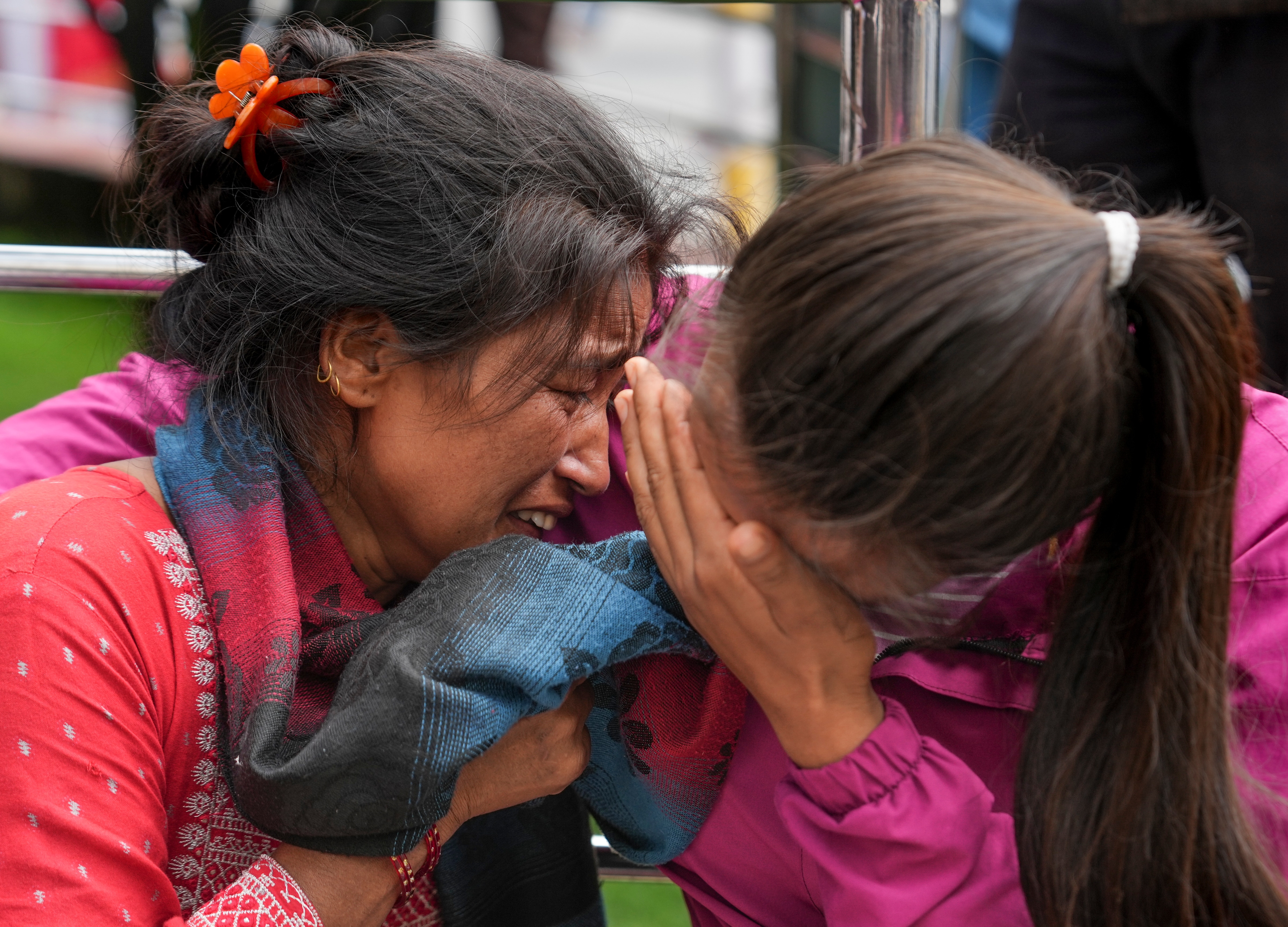 Family members and relatives of those missing, at Tribhuvan University Teaching Hospital, in Kathmandu. (PTI)